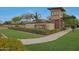 The Dorada Estates community entrance features well-maintained landscaping, shrubbery, and a brick gate structure at 17756 E Colt Dr, Queen Creek, AZ 85142