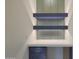 Close-up of the built-in desk area featuring unique textured glass and modern lighting at 17756 E Colt Dr, Queen Creek, AZ 85142