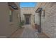 Inviting front entrance with modern stone accents, desert landscaping, and a covered entryway for guests at 17756 E Colt Dr, Queen Creek, AZ 85142