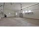 Garage with epoxy floors, storage shelves and room for multiple vehicles at 17756 E Colt Dr, Queen Creek, AZ 85142