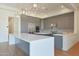 Modern kitchen features sleek countertops, stainless steel appliances, and ample storage at 17756 E Colt Dr, Queen Creek, AZ 85142