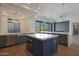 Open concept kitchen with stainless steel appliances, modern countertops, and a large kitchen island at 17756 E Colt Dr, Queen Creek, AZ 85142