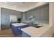 Contemporary kitchen features stainless steel appliances, modern fixtures, and elegant gray cabinetry at 17756 E Colt Dr, Queen Creek, AZ 85142