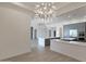 Spacious kitchen with modern countertops, stainless steel appliances, and a seamless flow to the living area at 17756 E Colt Dr, Queen Creek, AZ 85142