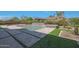 Stunning backyard features a sparkling pool, spa, and elegant hardscape design at 17756 E Colt Dr, Queen Creek, AZ 85142