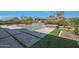 Inviting backyard with a stunning pool and spa and custom fire feature at 17756 E Colt Dr, Queen Creek, AZ 85142