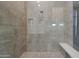 Modern walk-in shower featuring sleek fixtures and tiled walls at 17756 E Colt Dr, Queen Creek, AZ 85142