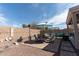 Lovely backyard featuring multiple seating areas, charming decor, a heater, and neat landscaping at 1844 E Angelica St, Casa Grande, AZ 85122