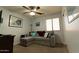 Comfortable bedroom with a convertible sofa and nautical-themed decor at 1844 E Angelica St, Casa Grande, AZ 85122