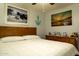 Comfortable bedroom featuring a bed, a dresser, and nautical-themed wall art at 1844 E Angelica St, Casa Grande, AZ 85122