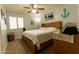 Comfortable bedroom featuring a bed, a laundry basket, and nautical-themed decor at 1844 E Angelica St, Casa Grande, AZ 85122