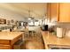Open-concept kitchen featuring updated countertops and adjacent dining space at 1844 E Angelica St, Casa Grande, AZ 85122
