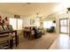 Open living room featuring neutral carpet, vaulted ceilings, and bright natural light at 1844 E Angelica St, Casa Grande, AZ 85122