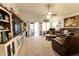 Inviting living room with comfortable seating, TV, and sliding doors to the backyard at 1844 E Angelica St, Casa Grande, AZ 85122