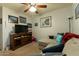 Comfortable living room featuring a sectional sofa, a TV, and nautical-themed decor at 1844 E Angelica St, Casa Grande, AZ 85122
