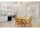Cozy dining area adjacent to the kitchen, featuring a wooden table and chairs with natural light at 18668 N Lariat Ct, Surprise, AZ 85387