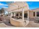 Covered patio area with seating and desert landscaping at 18668 N Lariat Ct, Surprise, AZ 85387