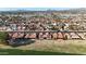 Expansive aerial shot featuring a Primary-planned community with mountain views set against a clear blue horizon at 1960 Leisure World --, Mesa, AZ 85206