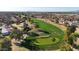 Scenic aerial perspective of a well-kept golf course surrounded by homes with traditional terracotta roofs at 1960 Leisure World --, Mesa, AZ 85206