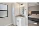 Bathroom features a granite countertop, storage cabinet, and modern vanity with seamless bedroom access at 1960 Leisure World --, Mesa, AZ 85206