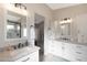 Dual vanity bathroom featuring sleek fixtures, granite countertops, and modern cabinetry at 1960 Leisure World --, Mesa, AZ 85206