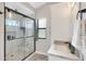 Stylish bathroom with a glass-enclosed shower, modern fixtures, and a granite countertop vanity at 1960 Leisure World --, Mesa, AZ 85206