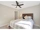 Comfortable bedroom with a cozy bed, ceiling fan, and natural light at 1960 Leisure World --, Mesa, AZ 85206