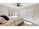 Cozy bedroom with a plush bed, a window, and a closet with mirrored sliding doors at 1960 Leisure World --, Mesa, AZ 85206
