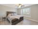 Comfortable bedroom features a ceiling fan and bright window with shutters and a window seat at 1960 Leisure World --, Mesa, AZ 85206