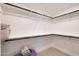 Walk-in closet featuring shelving and a hanging rack for organization and storage solutions at 1960 Leisure World --, Mesa, AZ 85206