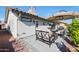 Charming exterior view of the home with a well-maintained patio and desert landscaping at 1960 Leisure World --, Mesa, AZ 85206