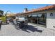 Back of home featuring large glass doors to patio and outdoor dining at 1960 Leisure World --, Mesa, AZ 85206