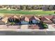 Charming home featuring a symmetrical facade, a two-car garage and manicured landscaping in a serene neighborhood at 1960 Leisure World --, Mesa, AZ 85206