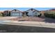 Charming single-story home with a well-maintained desert front yard and a two-car garage and terra cotta roof at 1960 Leisure World --, Mesa, AZ 85206