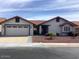 Charming single-story home with a well-maintained desert front yard and a two-car garage and terra cotta roof at 1960 Leisure World --, Mesa, AZ 85206