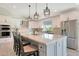 Bright kitchen with an oversized island, stainless appliances, and modern finishes at 1960 Leisure World --, Mesa, AZ 85206