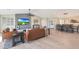 Stylish living area with hardwood floors, large-screen TV, comfortable seating, and adjacent dining space at 1960 Leisure World --, Mesa, AZ 85206
