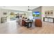Bright living room featuring sliding glass doors to the backyard, hardwood floors, and modern decor at 1960 Leisure World --, Mesa, AZ 85206