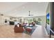 Bright, open-concept living space featuring hardwood floors, modern lighting, and seamless flow to the outdoor patio at 1960 Leisure World --, Mesa, AZ 85206