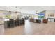 Open-concept living space features a kitchen island, living area, and sliding glass doors to the backyard at 1960 Leisure World --, Mesa, AZ 85206