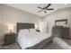 Comfortable main bedroom features neutral tones, ceiling fan, and coordinated furniture at 1960 Leisure World --, Mesa, AZ 85206