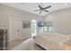 Light-filled main bedroom with vaulted ceiling, a ceiling fan, and ensuite bathroom access at 1960 Leisure World --, Mesa, AZ 85206