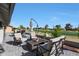 Outdoor lounge area with patio seating and beautiful golf course views at 1960 Leisure World --, Mesa, AZ 85206