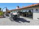 Outdoor patio space with a fire pit table and backyard view at 1960 Leisure World --, Mesa, AZ 85206