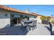 Comfortable patio area featuring dining set and barbecue, ideal for outdoor gatherings at 1960 Leisure World --, Mesa, AZ 85206