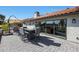 Cozy outdoor living area with patio seating and views of the backyard at 1960 Leisure World --, Mesa, AZ 85206