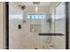 Elegant bathroom with glass shower, tile surround, and sleek black fixtures at 1960 Leisure World --, Mesa, AZ 85206