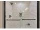 Modern shower featuring marble tiling, black hardware, and a convenient built-in shower niche at 1960 Leisure World --, Mesa, AZ 85206