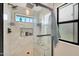 Elegant bathroom with glass shower, tile surround, and sleek black fixtures at 1960 Leisure World --, Mesa, AZ 85206