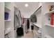 Spacious walk-in closet with custom shelving and ample storage space for clothes and accessories at 1960 Leisure World --, Mesa, AZ 85206